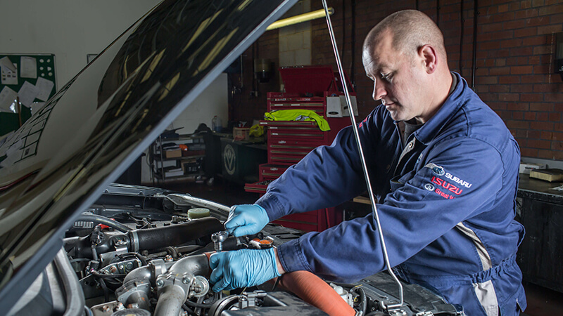 Mechanic servicing a D-Max